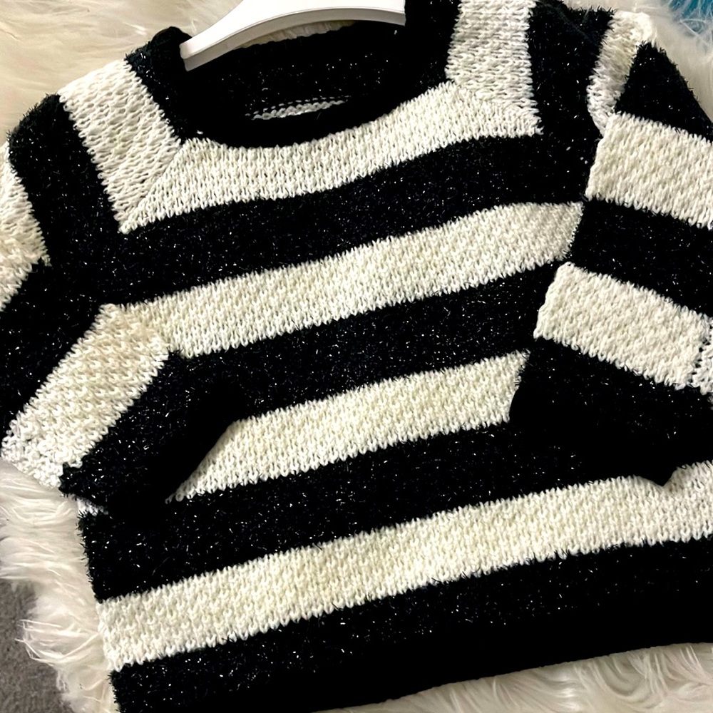 Girls black and white stripped sweater with a little shimmer.
